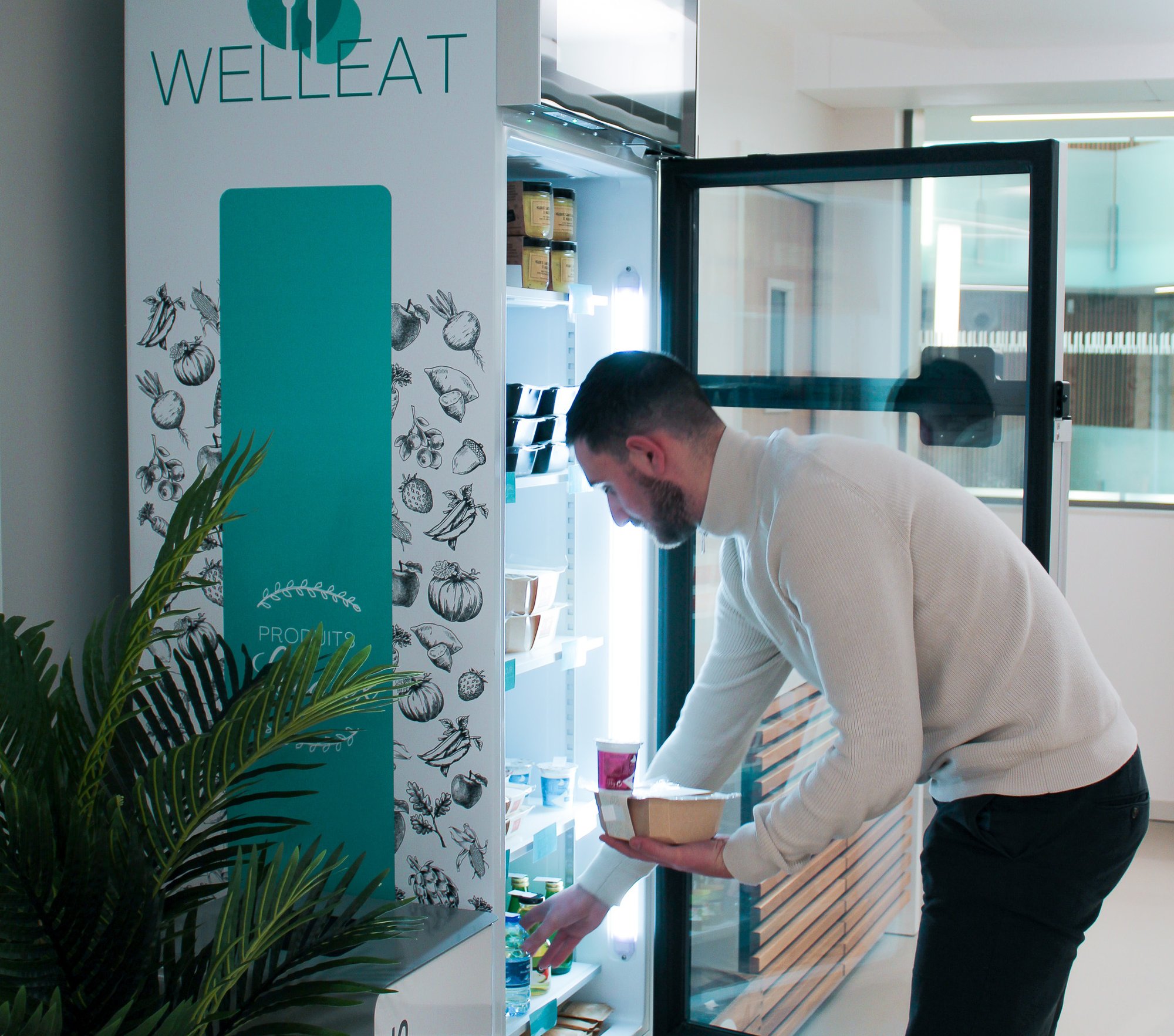 A man buying food from Selfly Stores smart vending machine